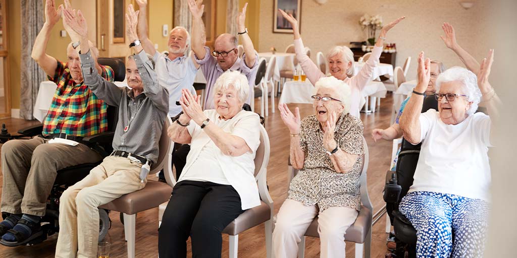 Seniors enjoying a fitness class in a retirement home